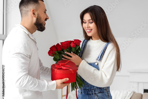 Young man with gift box and...