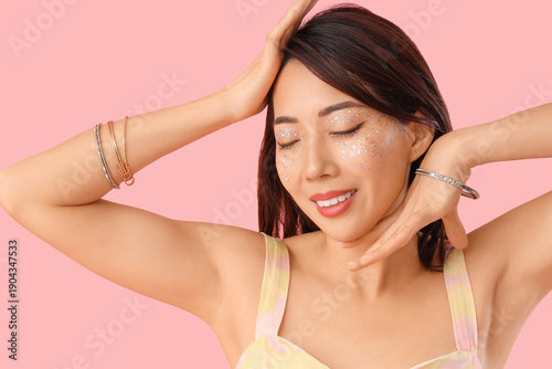Beautiful young happy Asian...