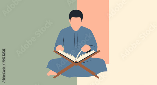Man reading a book sitting cross-legged.