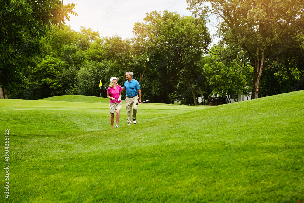 Fototapeta premium Senior couple, happy and walk at golf course with chat, laugh and bonding on vacation in summer. People, conversation and golfer with funny story, recreation or game on holiday at country club
