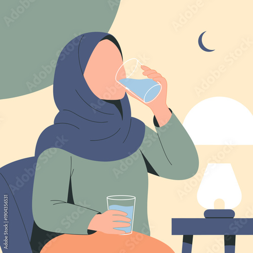 woman in hijab drinking water at night.