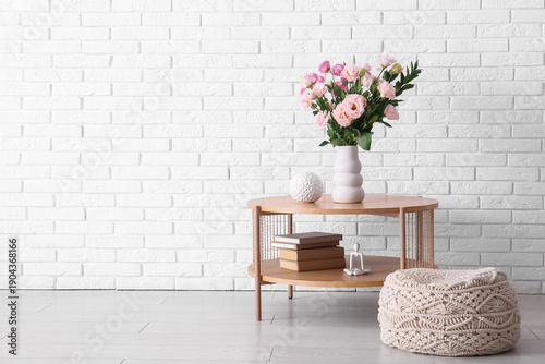 Pouf, table and vase with b...