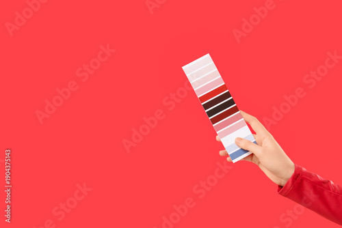 Female hand with color pale...