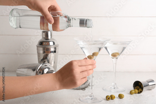 Female bartender pouring ta...