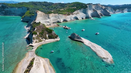 Spectacular Aerial Drone Footage of Cape Drastis in Corfu Greece Showcasing Unique White Clay Cliff Formations and Turquoise Lagoons of the Ionian Sea Popular Tourist Spot