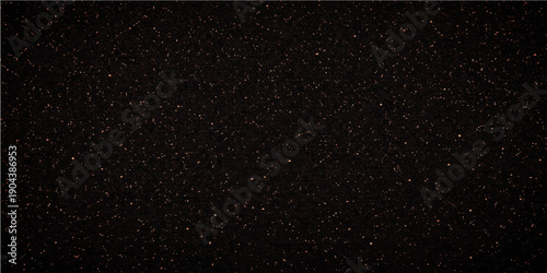 A dark abstract texture of rain drops on a window creates a starry night sky pattern resembling white dust and snow falling across the black universe of a deep space galaxy
