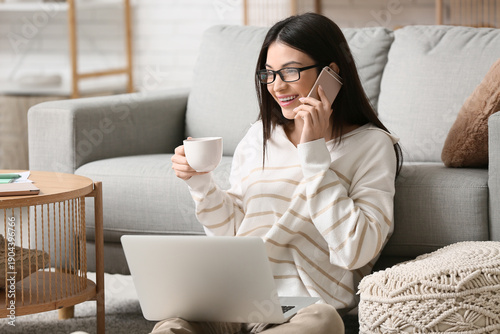 Beautiful young woman talki...