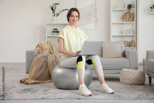 Sporty young woman with lap...