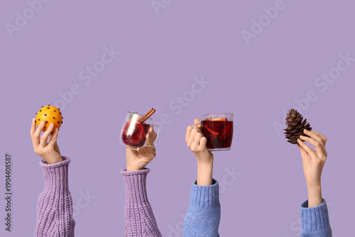 Female hands holding mugs o...