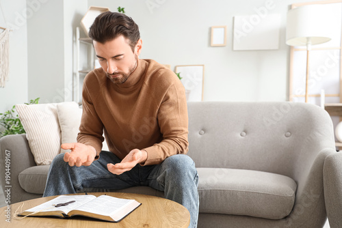 Religious man reading Bible...
