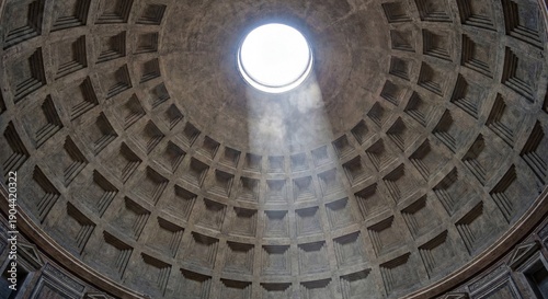 Architectural view of the Pantheon dome in Rome with a light beam shining through the oculus, highlighting the ancient concrete coffer