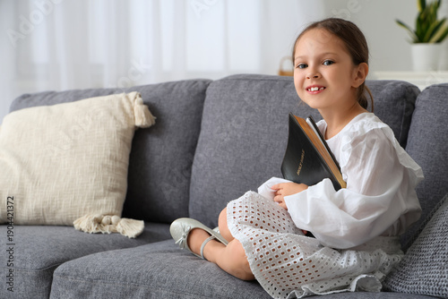 Cute little girl with Bible...