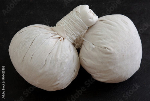 Herbal compress ball and Thai herbs for aromatherapy massage, Thai massage, traditional massage, Traditional herbal compresses are wrapped in natural cloth.