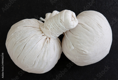 Herbal compress ball and Thai herbs for aromatherapy massage, Thai massage, traditional massage, Traditional herbal compresses are wrapped in natural cloth.