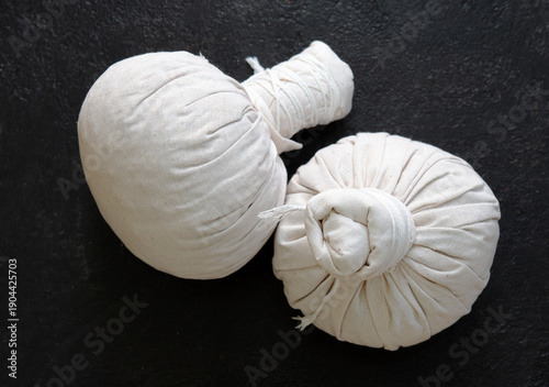 Herbal compress ball and Thai herbs for aromatherapy massage, Thai massage, traditional massage, Traditional herbal compresses are wrapped in natural cloth.