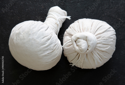 Herbal compress ball and Thai herbs for aromatherapy massage, Thai massage, traditional massage, Traditional herbal compresses are wrapped in natural cloth.