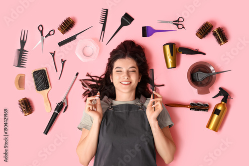 Happy young female hairdres...