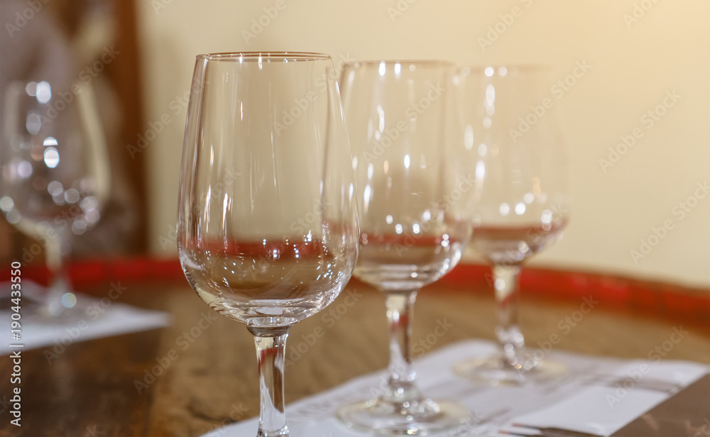 Fototapeta premium Empty wine glasses prepared for professional tasting session.