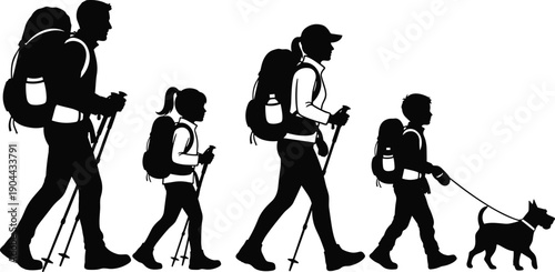 Silhouette of a happy family with two children and a small dog hiking together outdoors with backpacks and trekking poles