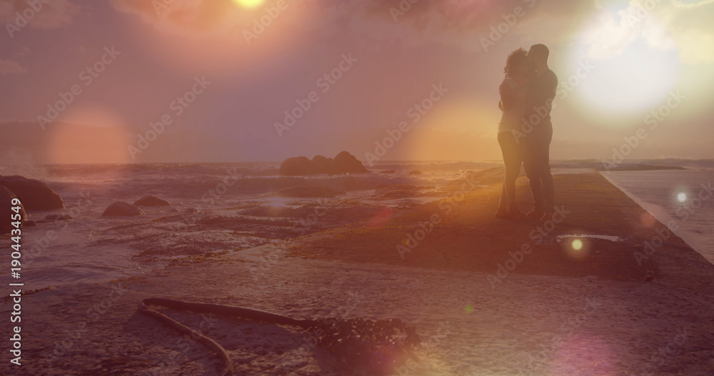 Obraz premium Image of light spots over african american couple at beach