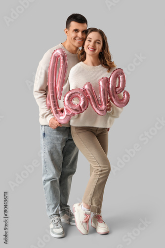 Happy young couple with air...