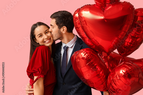 Young man kissing his girlf...