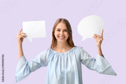 Pretty young woman holding ...