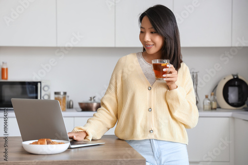 Beautiful young Asian woman...