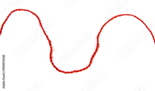 Foto Red thread isolate on white background. Selective focus. Old.