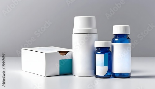 Medical supplies including bottles and packaging on a white surface.