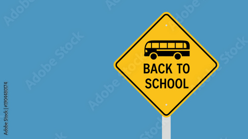 Back to school traffic sign with bus on yellow diamond shaped road sign