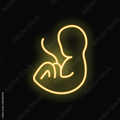 Yellow neon sign of a human fetus developing in a womb on a black background
