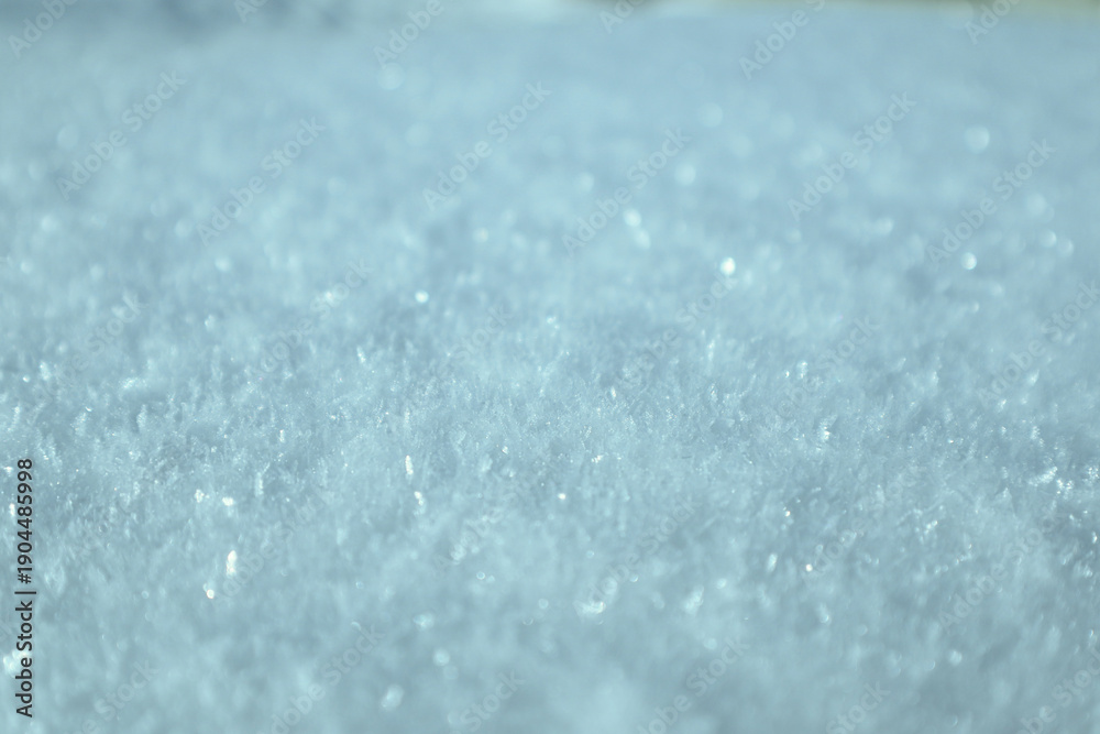 Obraz premium Macro shot of soft sparkling blue crystalline snow texture.