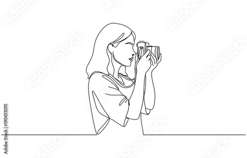 Continuous line drawing of a woman holding a camera up to her face taking a photograph.