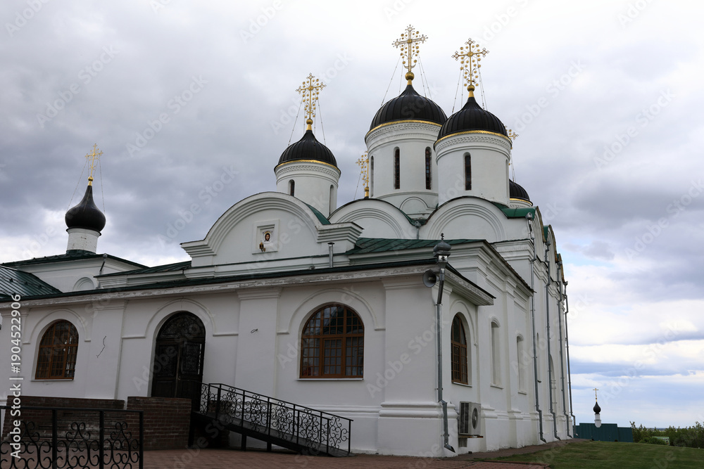 Fototapeta premium Spaso-Preobrazhensky monastery church with golden crosses on black domes
