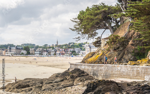 Tourists walking near the beach in Saint-Cast-le-Guildo - France