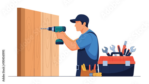 Professional carpenter uses an electric drill to secure wooden boards while his red toolbox and leather tool belt are ready for use on the job.