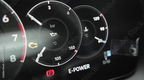 Macro Oil Pressure and Temperature Gauge on Car Dashboard