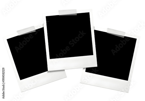 Three blank polaroid photos on a white surface for mockup purposes isolated on transparent background