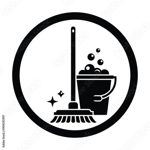 Black and white icon of a broom and bucket with bubbles and sparkles inside a circle