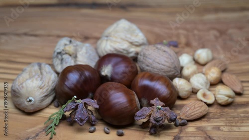 A composition of typically autumnal fruits such as walnuts and chestnuts enhancing their beauty and detail.