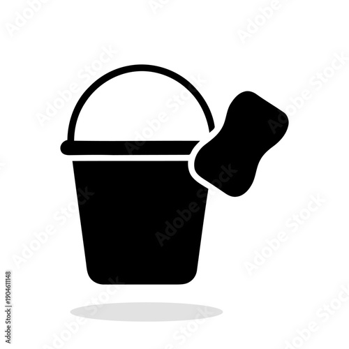 A bucket and sponge silhouette icon. Graphic symbol in black color, which symbolizes cleaning, washing, and housework. Vector illustration.