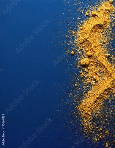 a shimmering pile of scattered gold flakes on a smooth blue background, sparkling under soft, even studio lighting