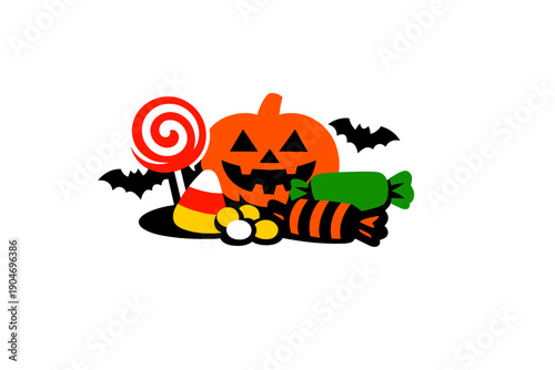 Halloween pumpkin sits among candies and lollipops with bats in a simple arrangement on a plain background celebrating the festive season of trick or treat fun