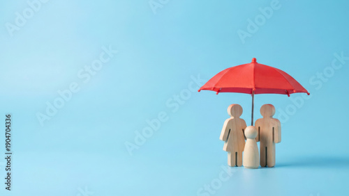 Family protection under red umbrella blue background conceptual image term life insurance safe environment
