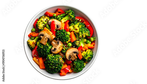 Vibrant bowl of cooked vegetables, overhead view, black backdrop