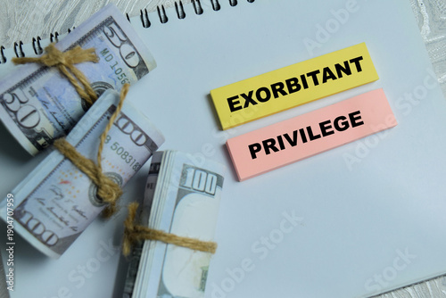 Photography Concept of exorbitant privilege write on sticky notes isolated on Wooden Table