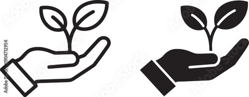 Hands holding and nurturing small plants with leaves growing