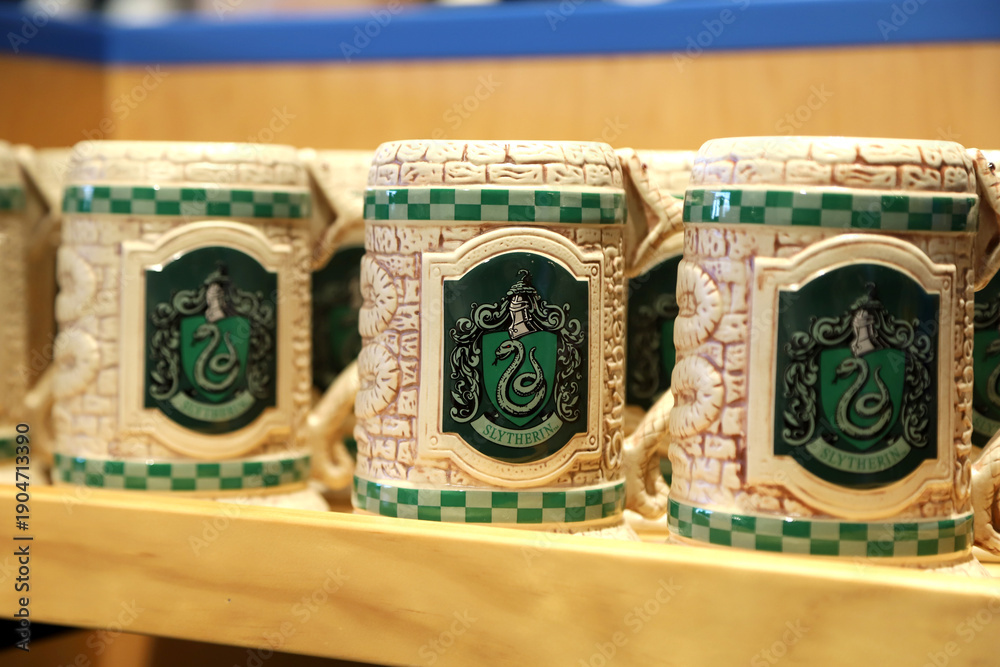 Fototapeta premium Slytherin house crest mug from Harry Potterdisplayed at Universal Studios Theme Park Store in Orlando, Florida