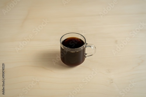 black coffee served in a clear glass mug